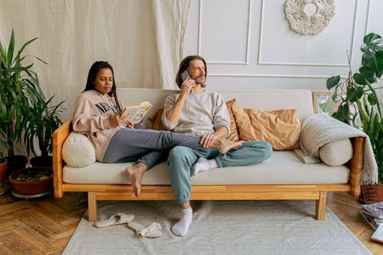 A Couple Staying at Home Relaxing on the Couch
