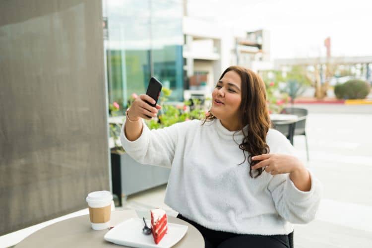 Woman influencer posting a story on her social media