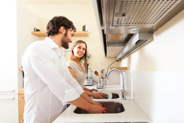 Young Couple Doing Dishes