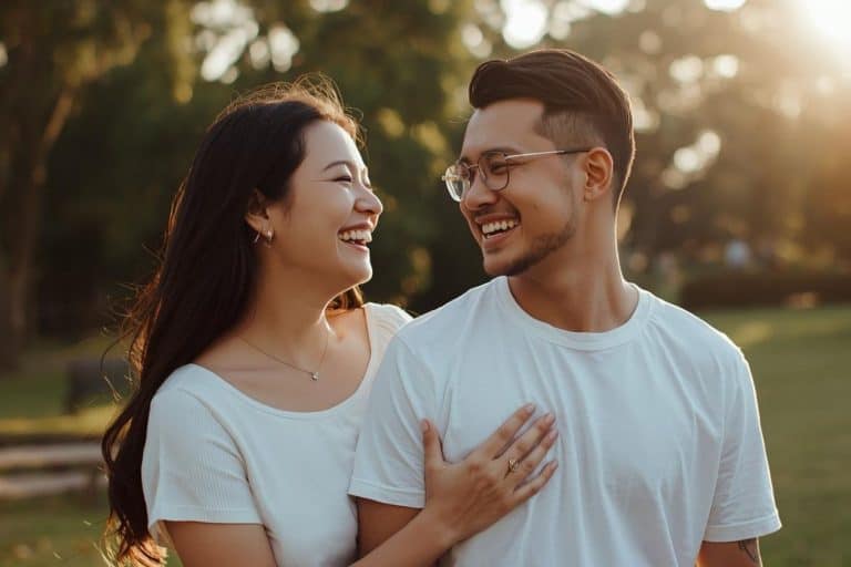 A happy couple, likely in the Philippines, smiling outdoors, representing an authentic look at dating a Filipina girl beyond stereotypes.
