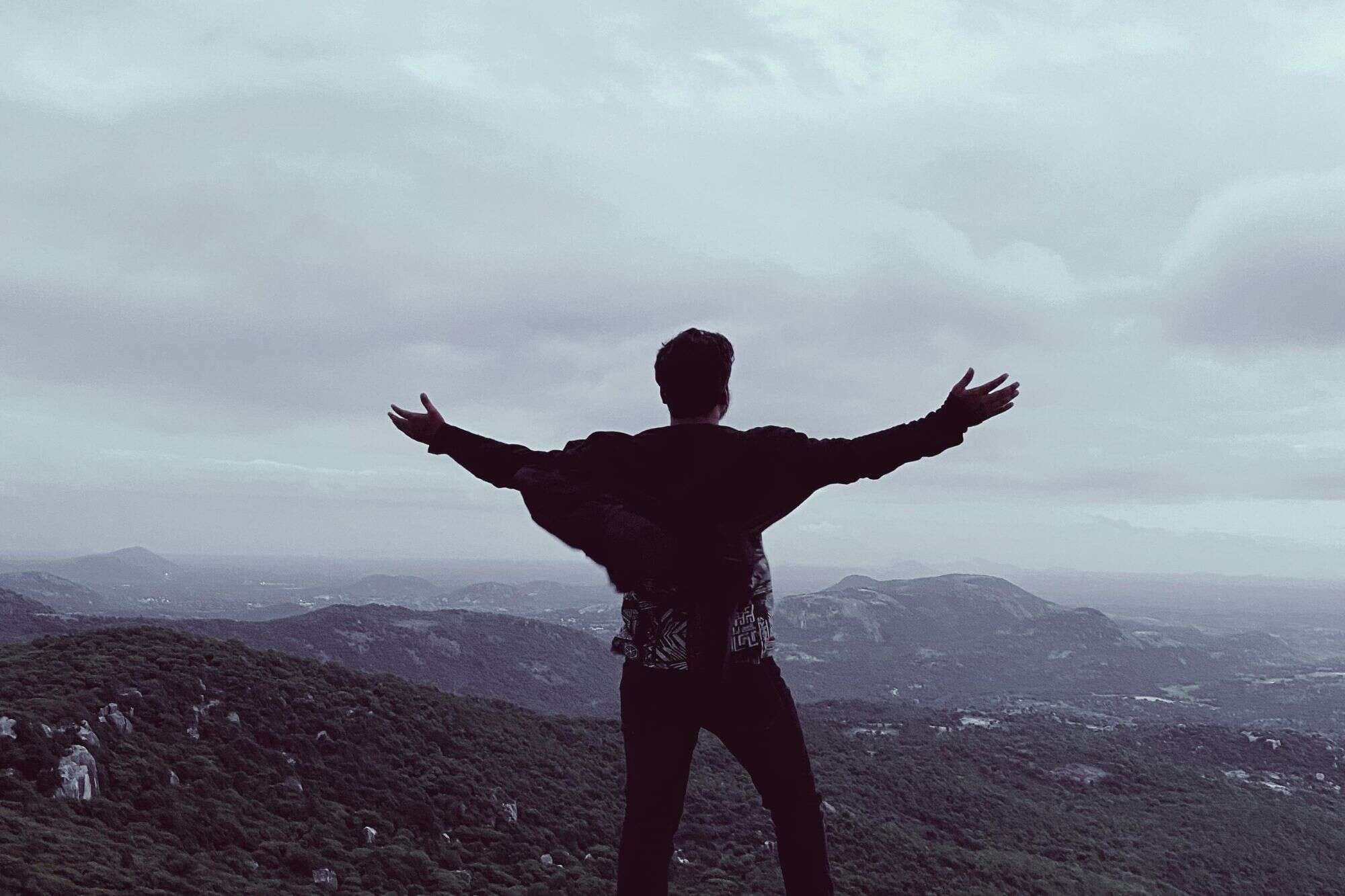 A wide-angle, minimalist landscape of a calm horizon, representing the clarity and peace found when letting go of the need for validation.