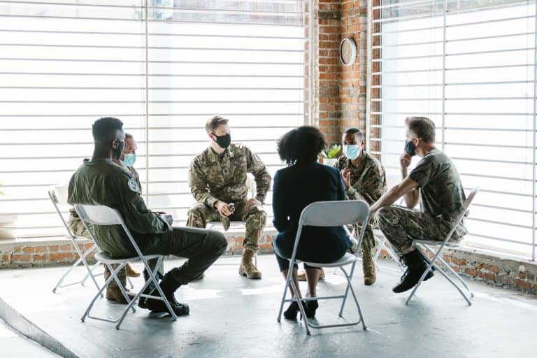 A group of men talking during a session