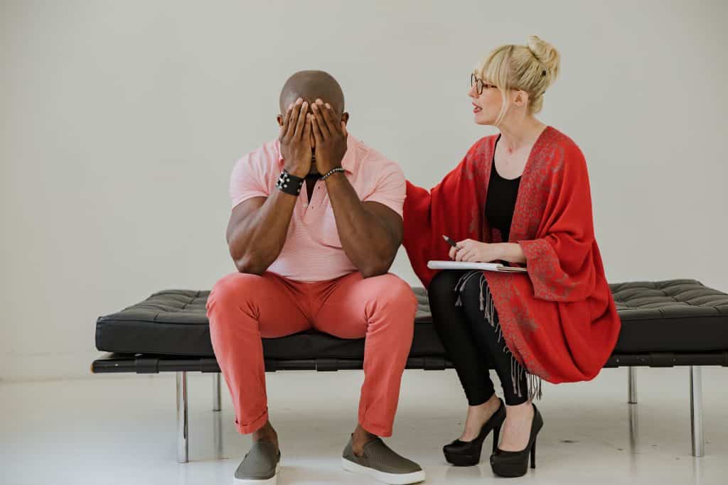 man getting coached by a woman