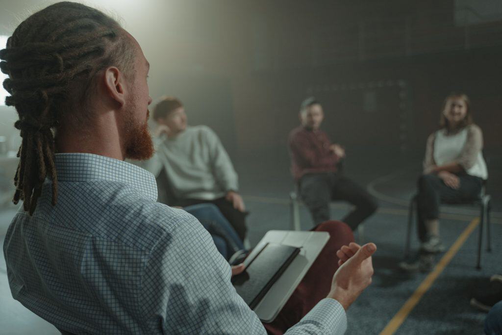 a man leading a group session